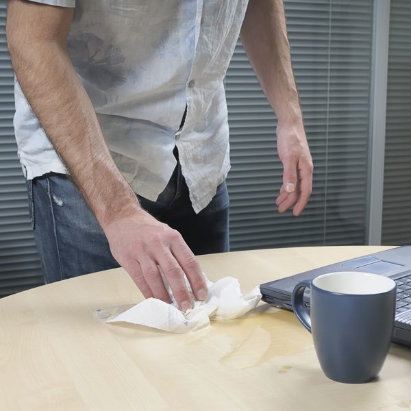 Metrolina-Neurological-Associates-man-cleaning-up-spill-from-movement-disorder